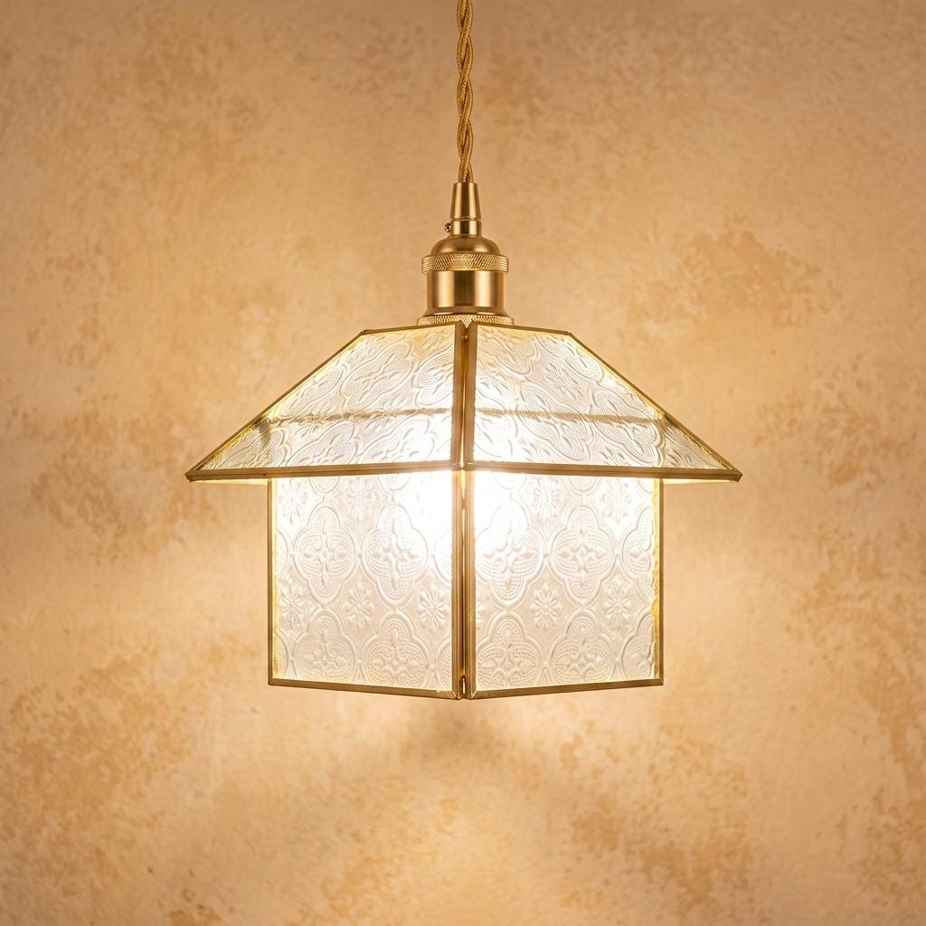 Clear patterned house-shaped pendant light with a warm gold-tone frame