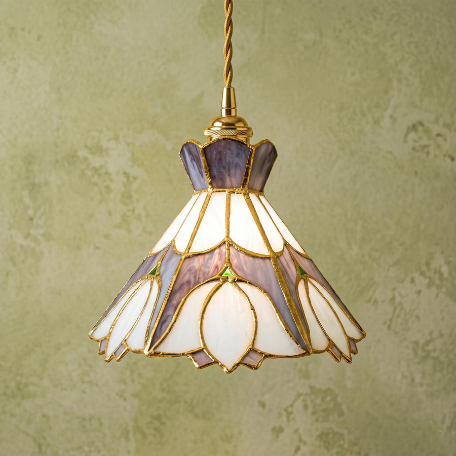 Lavender and cream floral stained glass pendant light against a pale green wall