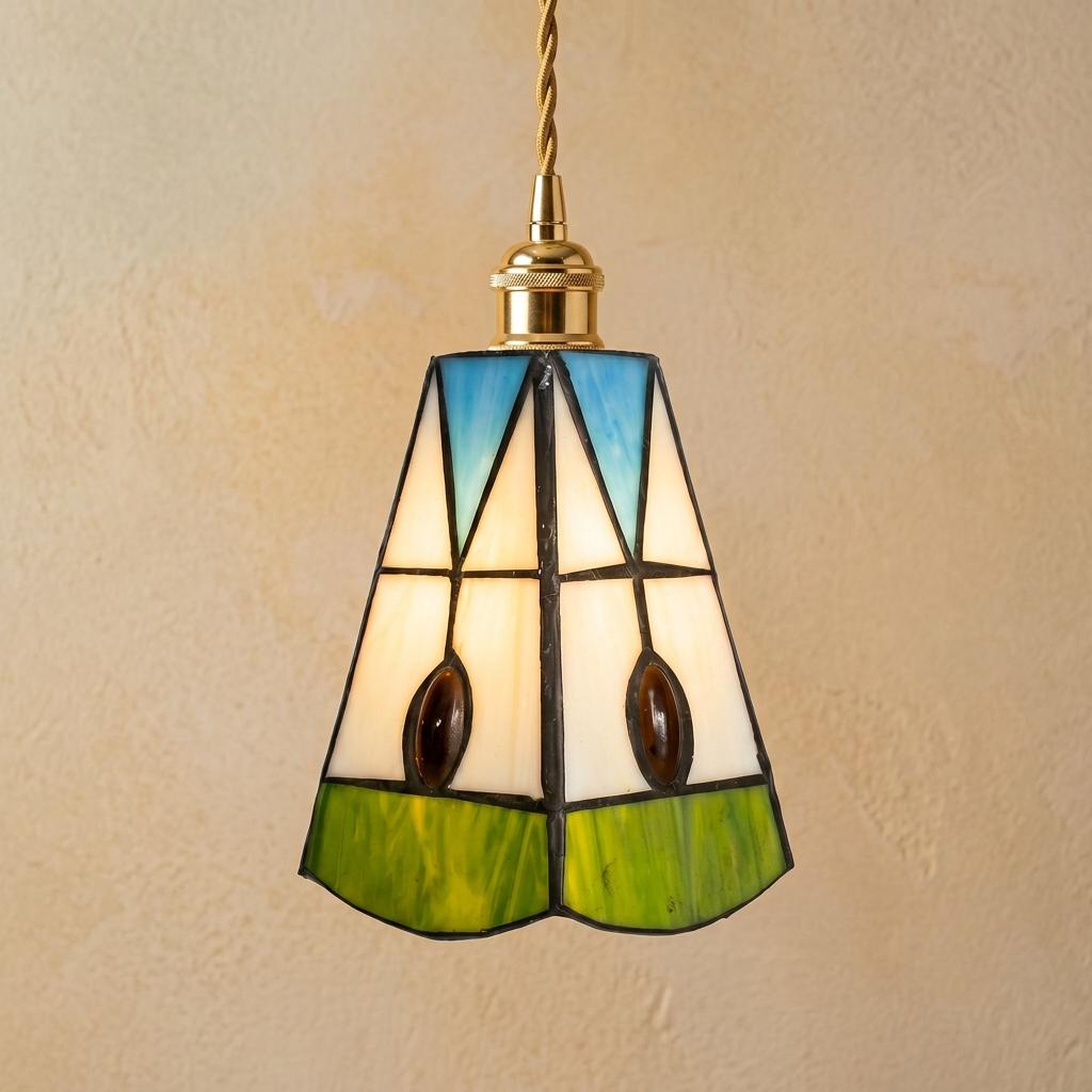 Handmade Cream Bell Tiffany-Inspired Pendant Light with Blue Triangles and Amber-tone Oval Details by AuroraeGlass