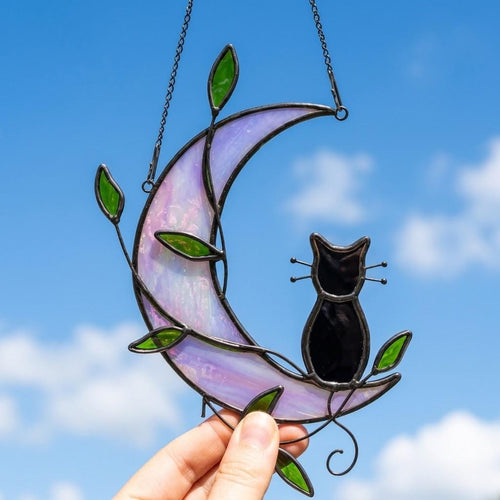 Black Cat Window Hanging on Purple Crescent Moon with Green Leaves by AuroraeGlass — photo 1